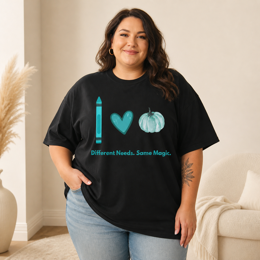 Plus-size curvy woman wearing the black Different Needs Same Magic Comfort Colors oversized tee