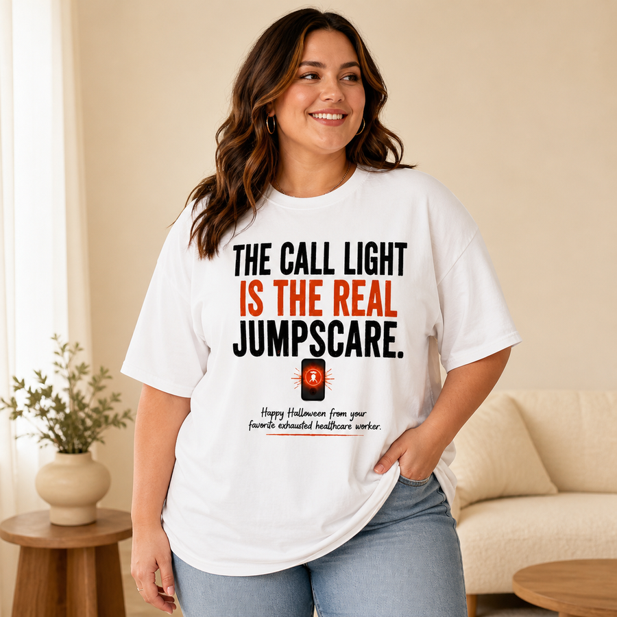 Curvy plus-size woman wearing the white Call Light Halloween Nurse oversized Comfort Colors tee