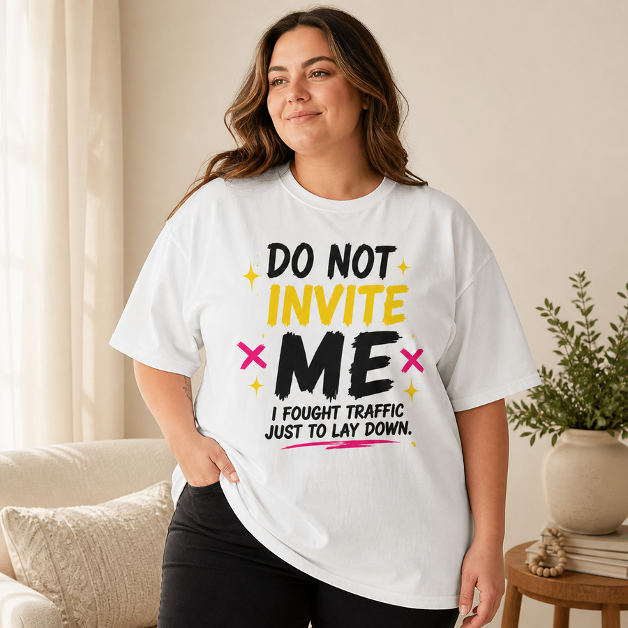 Plus-size curvy woman wearing the white Do Not Invite Me Comfort Colors oversized tee