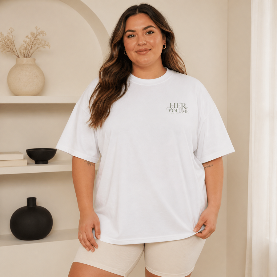 Curvy plus-size woman wearing the white Emotionally Expensive oversized Comfort Colors tee